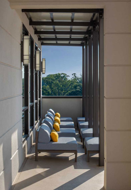 Covered lounge seating on balcony
