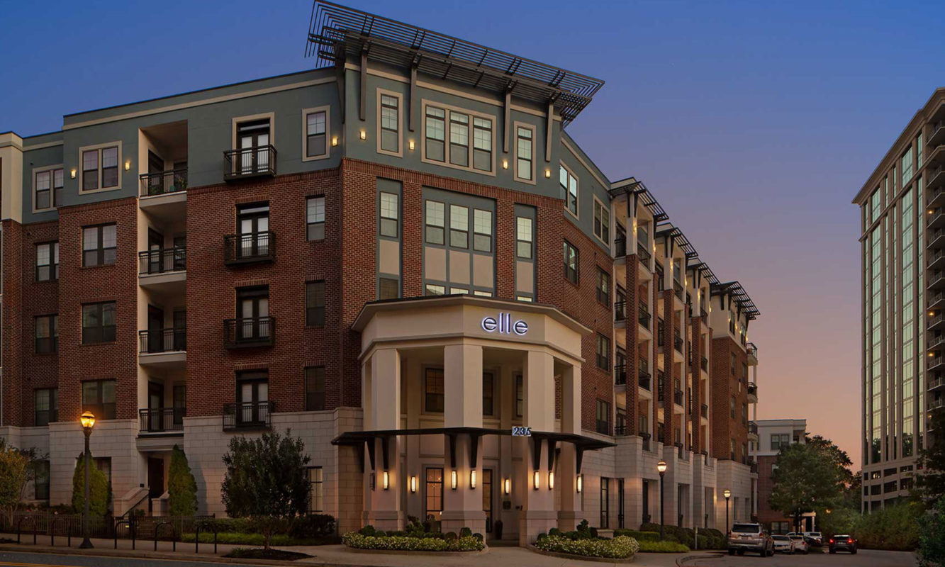 Dusk shot of building exterior with entrance