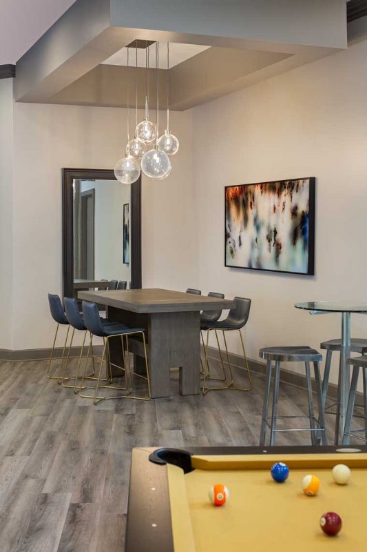 lounge area view from billiard table with various seating and decor